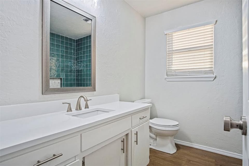 Tessa Hood Realtor – Updated bathroom vanity with teal tile shower at 1112 County Street 2910, Tuttle Oklahoma