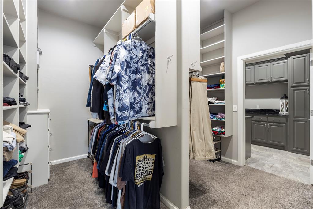 Tessa Hood Realtor – Large walk-in closet with built-in shelving at 516 Kings Ct, Tuttle Oklahoma