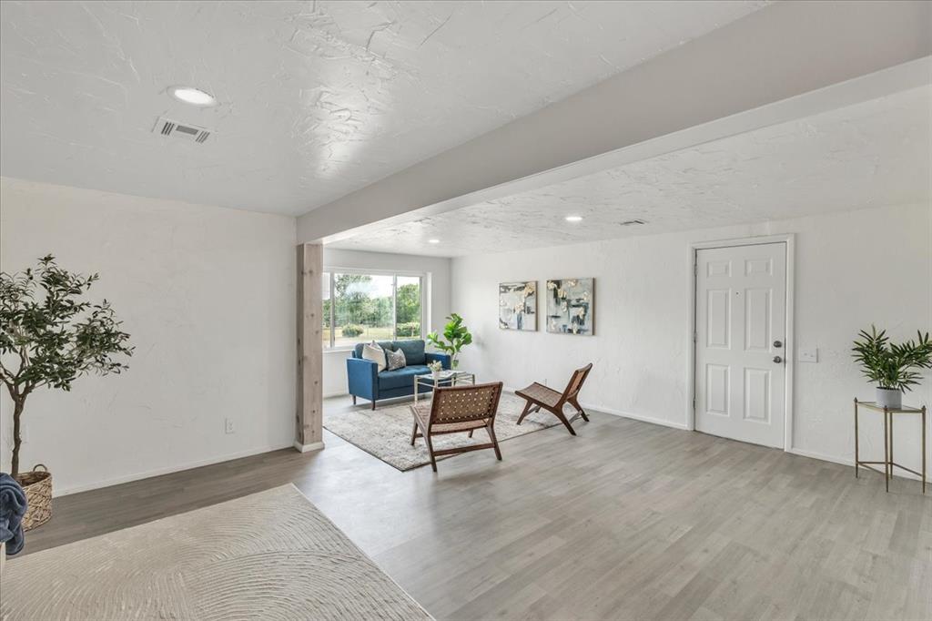 Tessa Hood Realtor – Entry foyer open to bright living area at 7400 Lakewood Dr, Mustang Oklahoma
