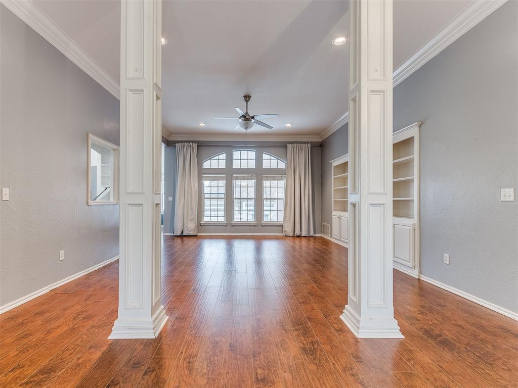Tessa Hood Realtor – Formal living room with decorative columns and built-in shelving at 5879 Mockingbird Ln, Blanchard Oklahoma