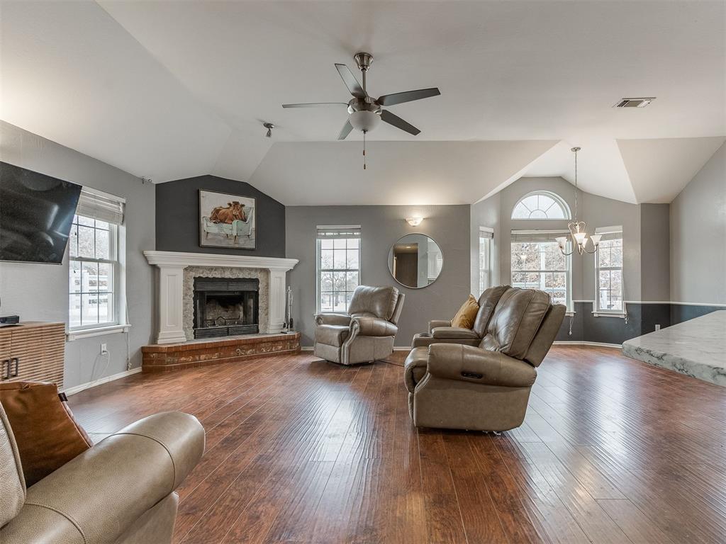 Tessa Hood Realtor – Family room fireplace open to kitchen and dining at 5879 Mockingbird Ln, Blanchard Oklahoma