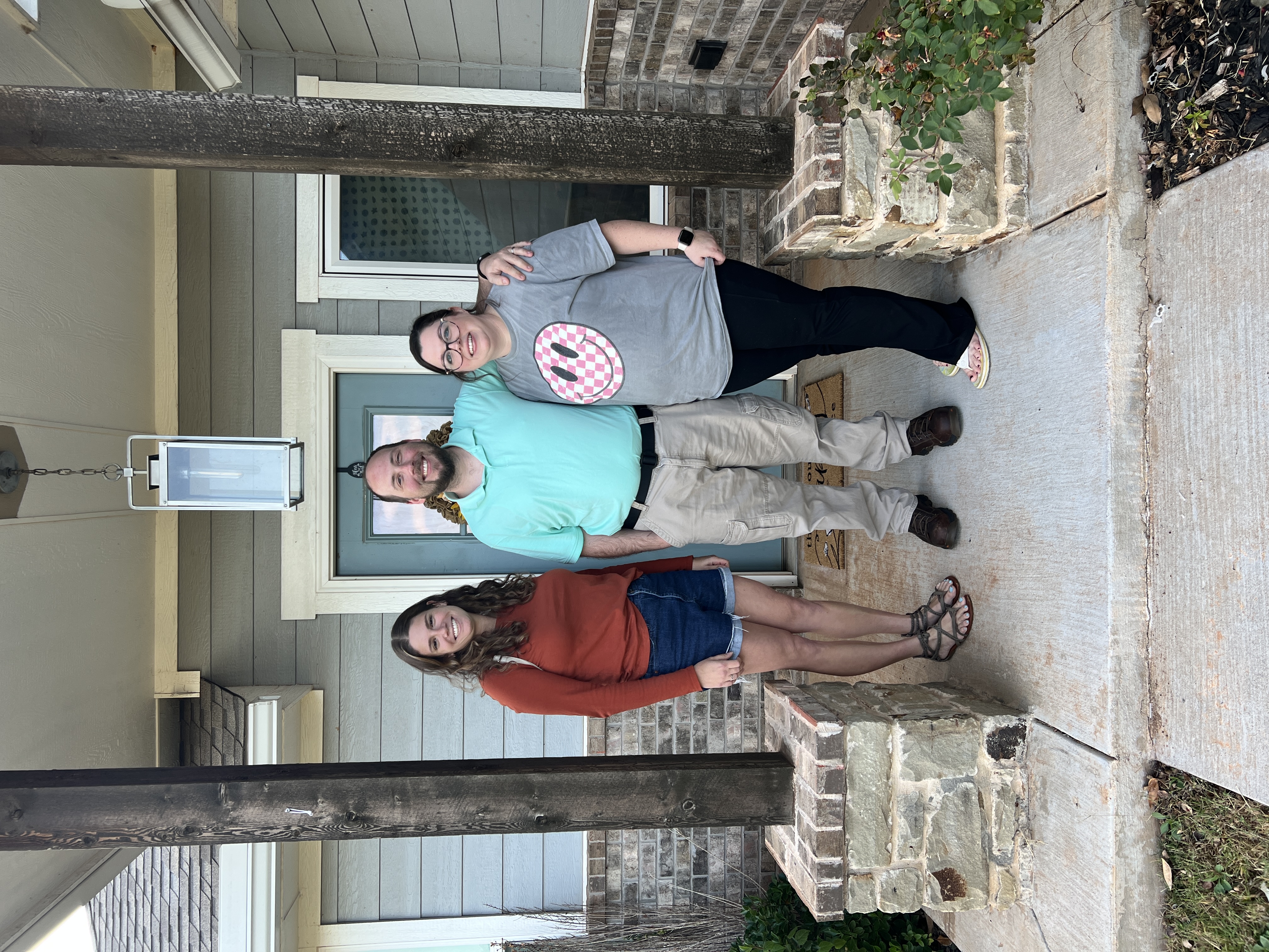 Tessa Hood Realtor with new home buyers at their front door – Newcastle Oklahoma