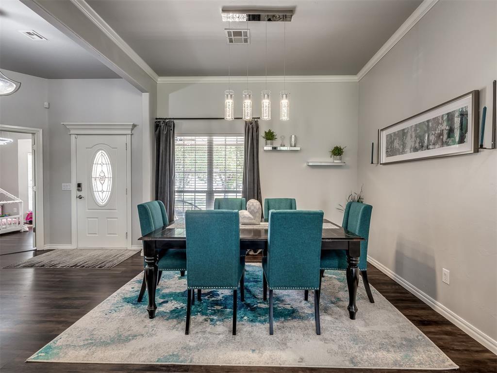 Tessa Hood Realtor – Dining room with chandelier and entry foyer at 6910 Rolling Meadows Dr, Tuttle Oklahoma
