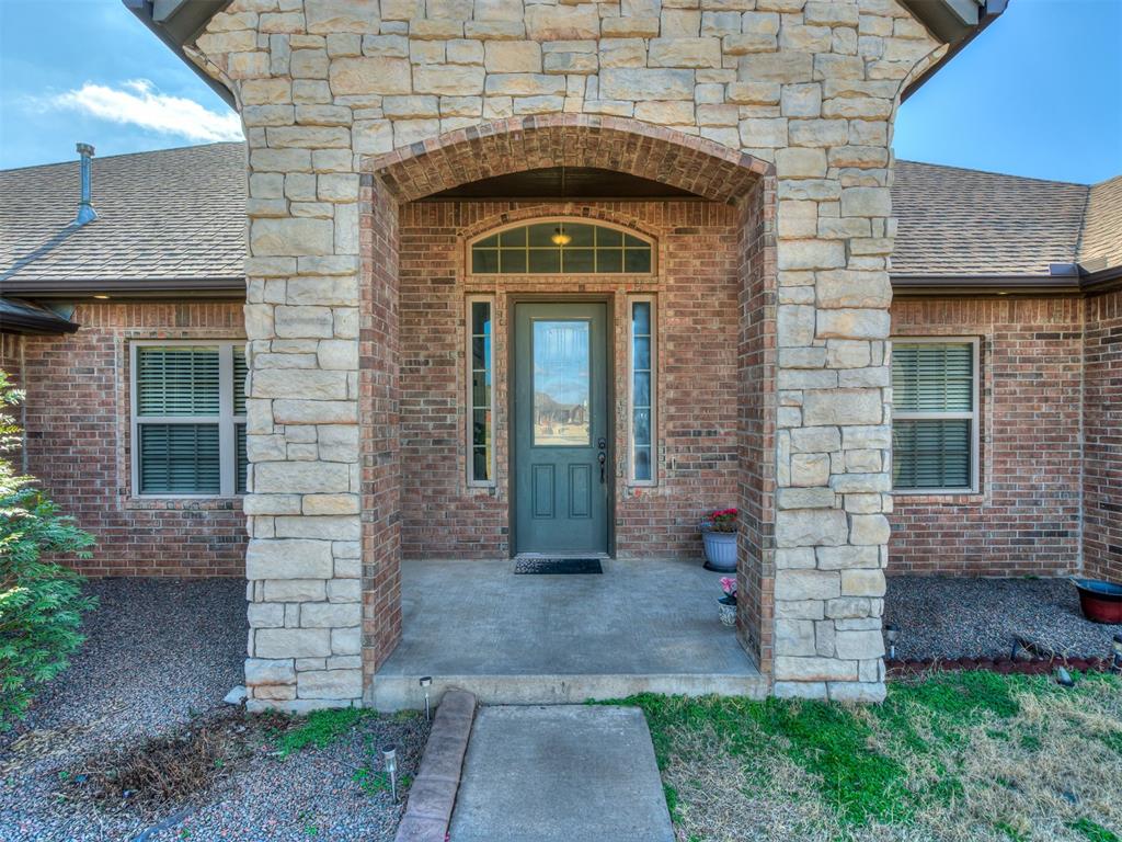 Tessa Hood Realtor – Stone arch entry door detail at 5708 SE 148th St, Oklahoma City OK