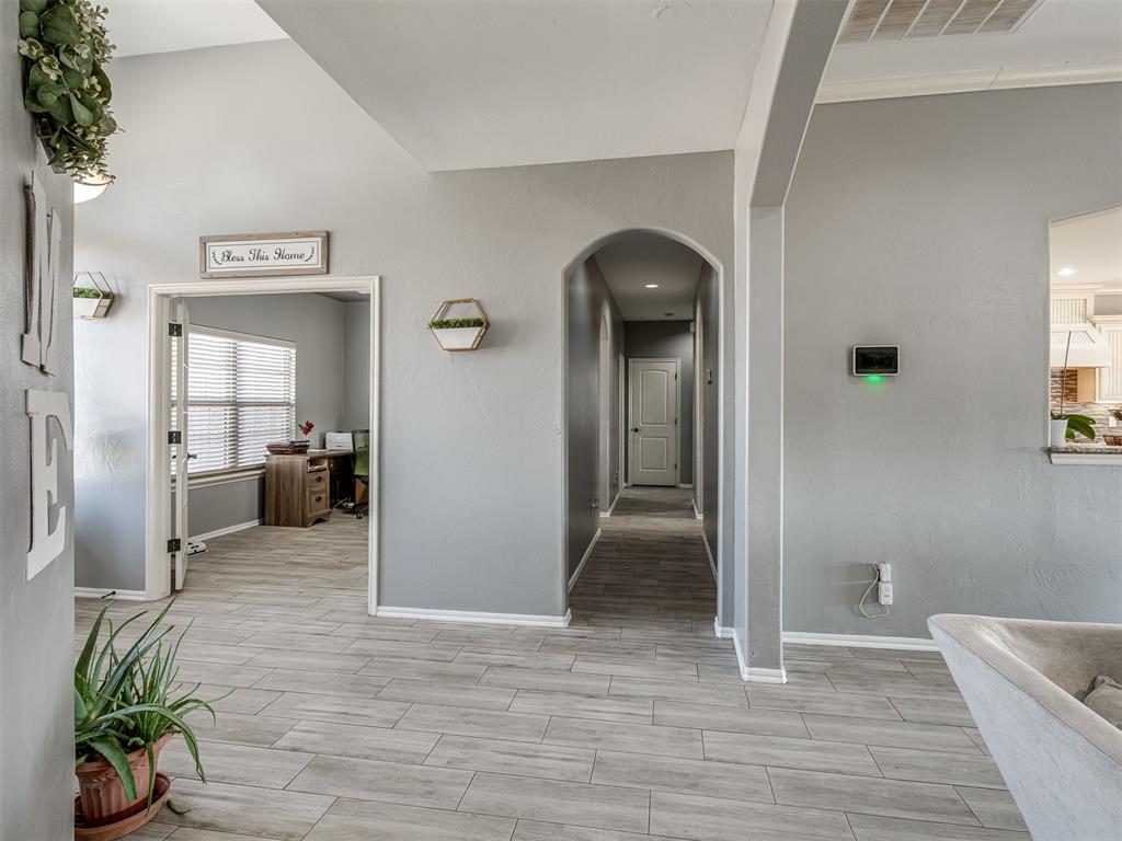 Tessa Hood Realtor – Hallway view with home office and arched passage at 5708 SE 148th St, Oklahoma City OK