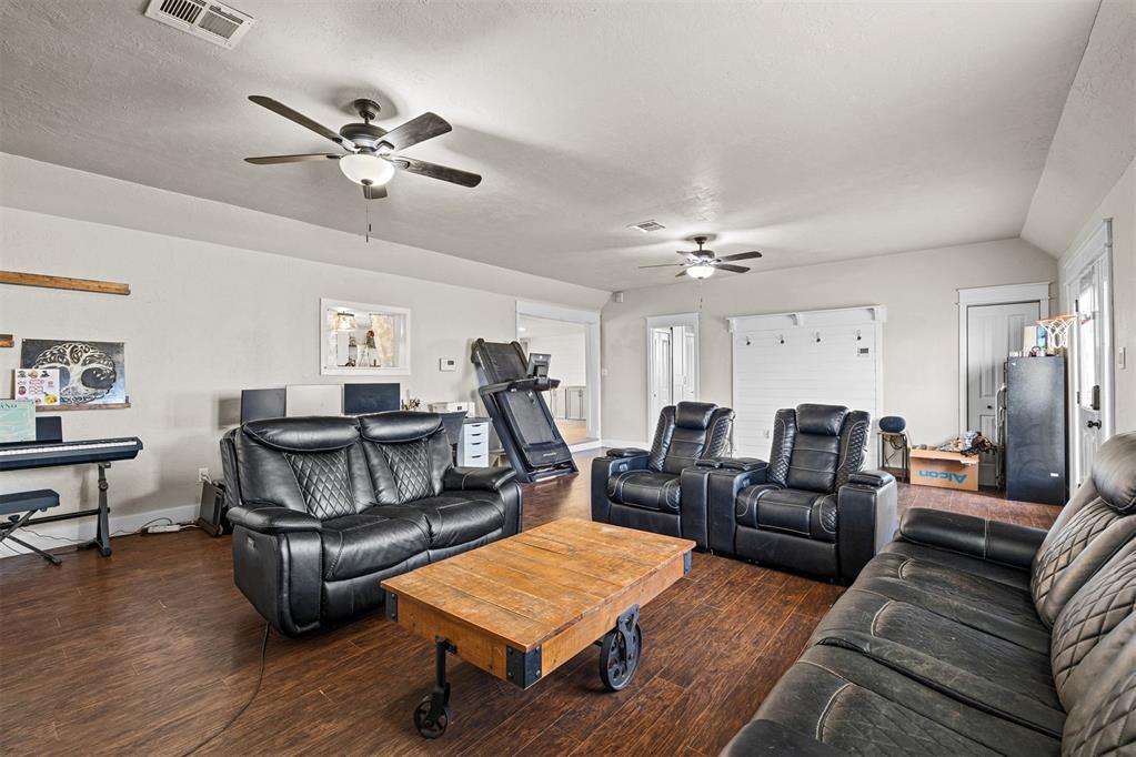Tessa Hood Realtor – Living room with wood floors and open layout at 21063 State Hwy 76, Blanchard Oklahoma