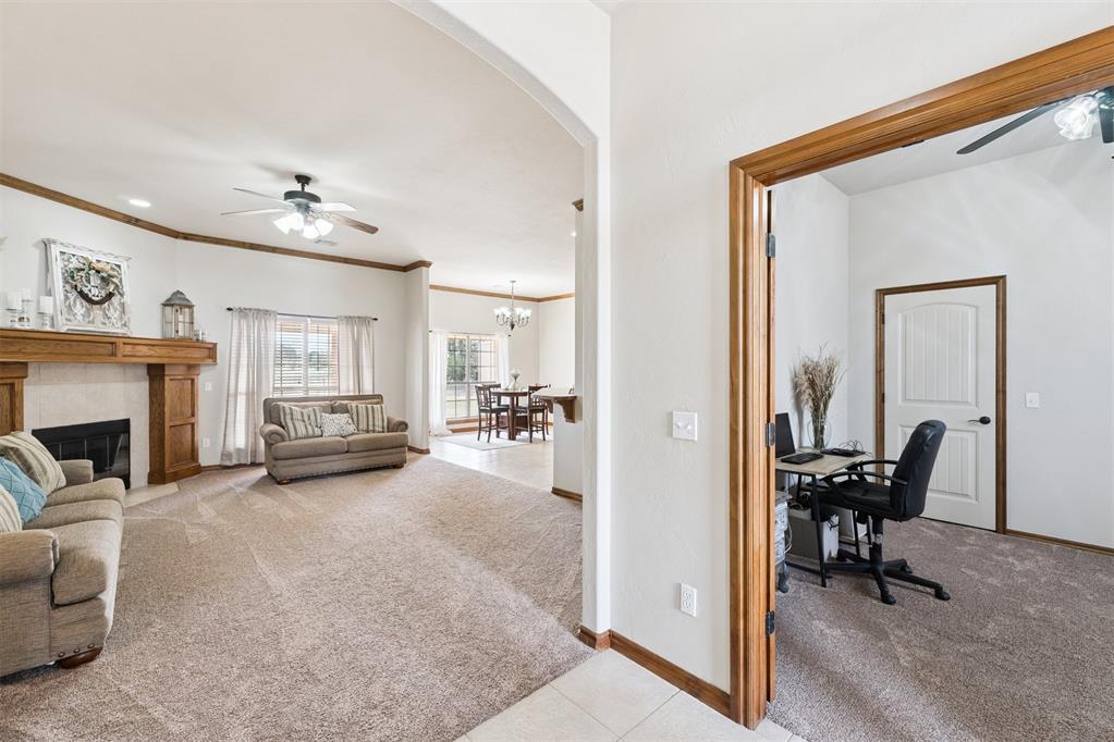 Tessa Hood Realtor – Living room with fireplace and flex room office at 1928 SW 9th St, Newcastle Oklahoma