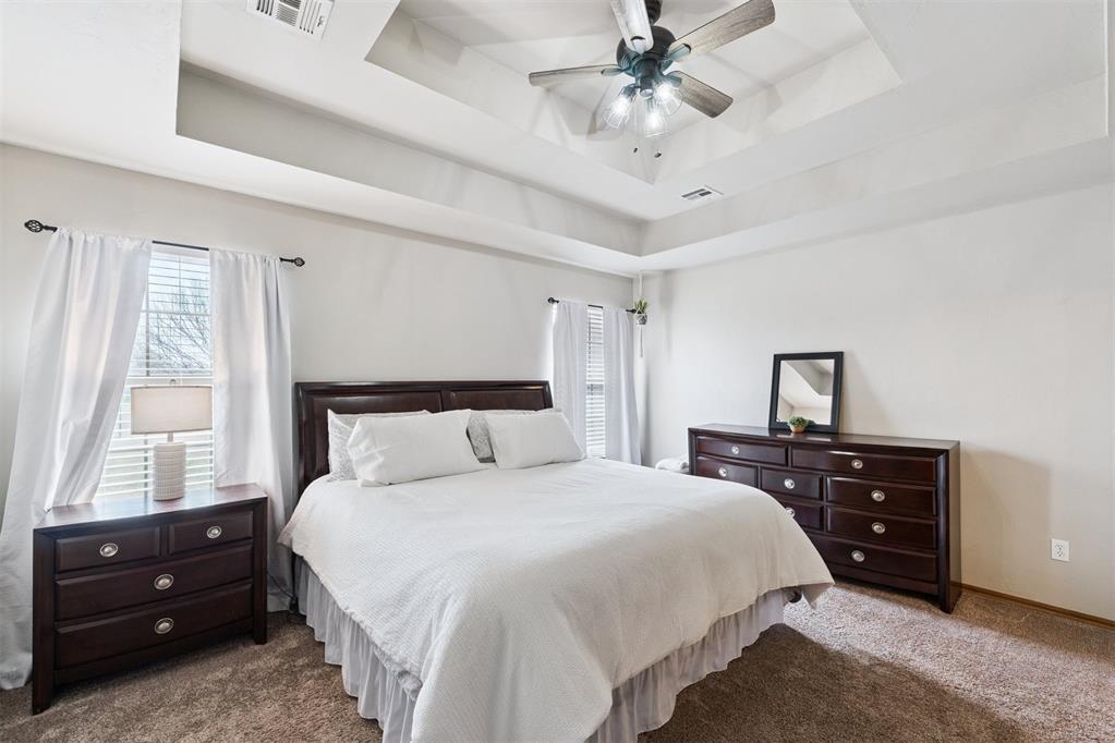 Tessa Hood Realtor – Primary bedroom with tray ceiling and ceiling fan at 1928 SW 9th St, Newcastle Oklahoma