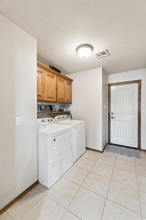 Tessa Hood Realtor – Laundry room with overhead cabinets and tile floor at 1928 SW 9th St, Newcastle Oklahoma
