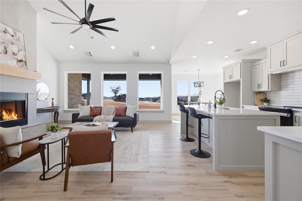 Tessa Hood Realtor – Open concept living room and kitchen with fireplace at 2439 Wind River Cir, Blanchard Oklahoma
