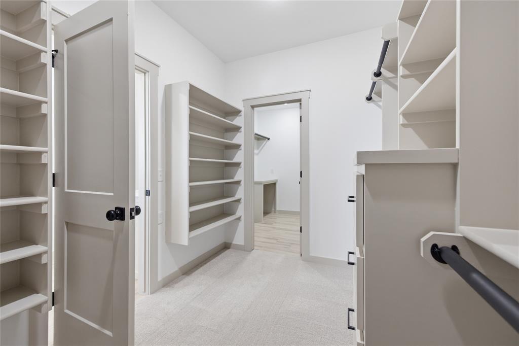 Tessa Hood Realtor – Walk-in closet with built-in shelving at 2439 Wind River Cir, Blanchard Oklahoma