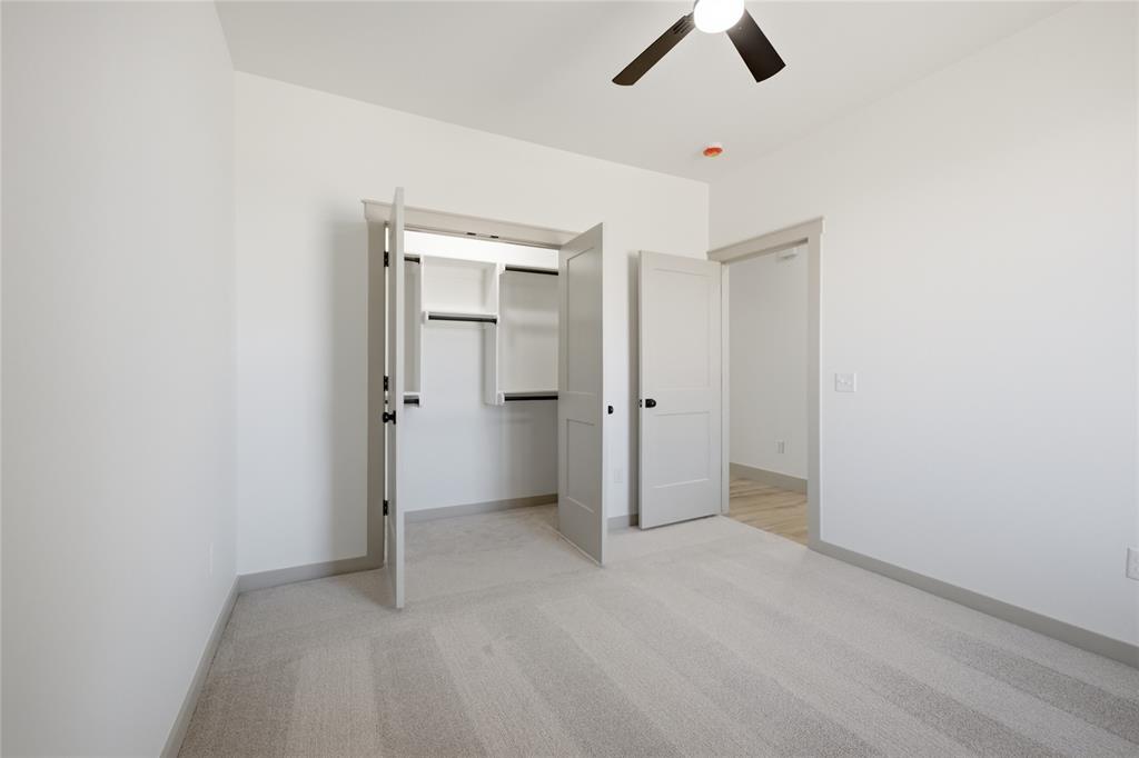 Tessa Hood Realtor – Secondary bedroom with walk-in closet at 2439 Wind River Cir, Blanchard Oklahoma